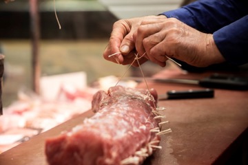 ribs being seasoned and prepared