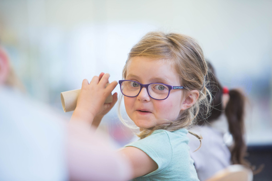 Little girl enjoying arts and crafts