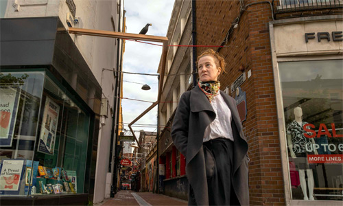 Woman-standing-at-the-entrance-to-Careys-Lane